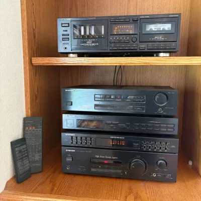 Sale Photo Thumbnail #66: This Pioneer audio system features a range of high-quality components, including a CT-WM 77R multi-cassette changer with auto reverse and Dolby HX Pro, the VSP-333 AV surround processing amplifier, the TX-1330Z FM/AM digital synthesizer tuner, a 5-band gr