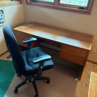 Sale Photo Thumbnail #197: This office furniture set features a large wooden desk and a comfortable ergonomic chair, perfect for any workspace. The desk measures 28 inches tall, 62 inches wide, and 27.5 inches deep, offering ample surface area and storage with multiple drawers for 