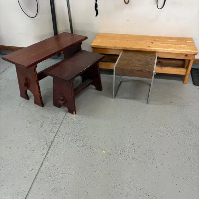 Sale Photo Thumbnail #196: This collection features a variety of wooden benches and end tables, each with unique dimensions and distinct wood finishes. The set includes benches sized 17.5" x 48" x 16.5", 20.5" x 35.5" x 14.5", and 17.5" x 24" x 12", as well as an end table measurin