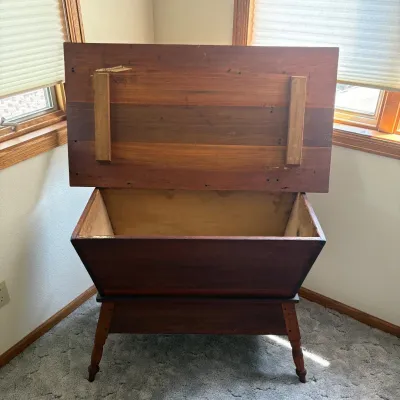 Sale Photo Thumbnail #21: This antique wooden dough box features a large, deep interior perfect for storage or display. Historically used in 19th-century farmhouses for mixing and letting bread dough rise. Crafted from rich, warm wood, it stands 28 inches tall with a 40 inch wide 