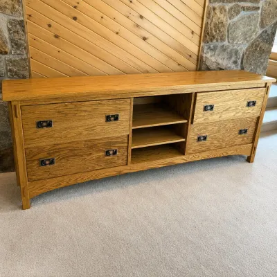 Sale Photo Thumbnail #187: This Multi - drawer oak storage cabinet features classic dovetail joinery, enhancing both its durability and aesthetic appeal. Crafted from rich oak, the cabinet measures 30.5 inches tall, 84.5 inches wide, and 25 inches deep, providing ample storage spac