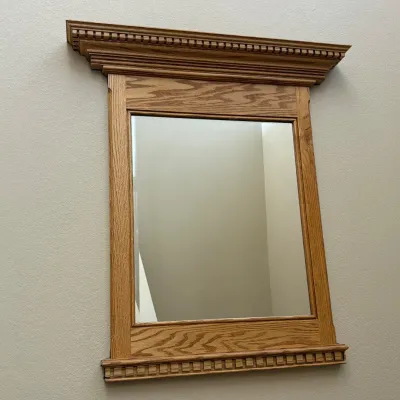 Sale Photo Thumbnail #164: This solid wood wall mirror features a timeless classic crown molding design, adding elegance and sophistication to any room. Measuring 37.5 inches tall and 34 inches wide at the top, the mirror is crafted from high-quality wood with a natural finish that