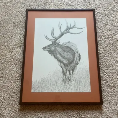 Sale Photo Thumbnail #79: Striking signed and numbered wildlife art print by illustrator Cheri Ziebart, featuring a large bull elk standing among tall grasses with a mountainous landscape in the background. The detailed monochromatic composition showcases intricate linework throug