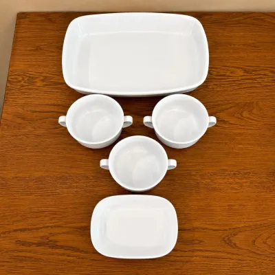 Sale Photo Thumbnail #133: This elegant Williams-Sonoma set features 3 white porcelain soup bowls alongside 6 corning-ware SIDEKICK ceramic side dishes, each measuring approximately 7.5 inches in length and 2 inches in height. The collection also includes an 11-inch porcelain bakin