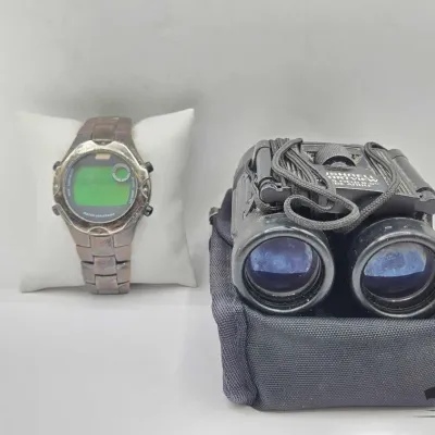 1910 coleman digital watch and bushnell binoculars