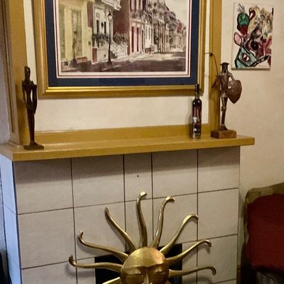 French Quarter scene of house on Bourbon st, Spanish figures, golden sun figure