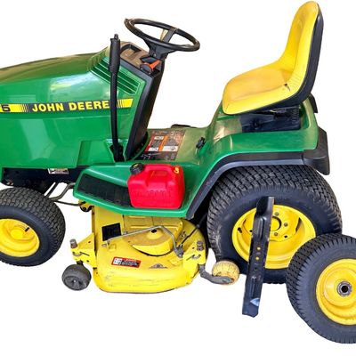 Sale Photo Thumbnail #146: John Deere GT275 Garden Tractor with a Yellow seat, a Mower deck, and Extra Wheel