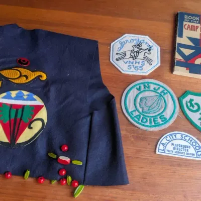 Vintage Camp Fire Girls Ceremonial Vest paired with its Original Handbook and Patches
