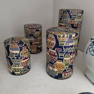 Set of 3 Decorative Cylindrical Canisters with Pottery Motif
