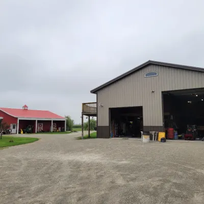 Sale Photo Thumbnail #193: Here's the back of the property 2 Pole Barns - FULL!