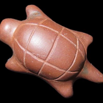 Sale Photo Thumbnail #43: Rare Turtle Effigy Poverty Point Jasper Bead / Pendant. Ex Charles Moore Collection, part of his well known Poverty Point Bead frame which was pictured several times. Great example, nicely polished, engraved, and drilled for suspension.