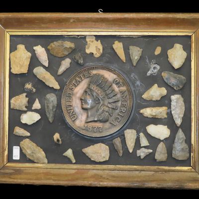 Sale Photo Thumbnail #421: 17" x 13" Wood Frame with Arrowheads & Oversized 1877 Indian Head Penny. Out of an old Indiana Collection.