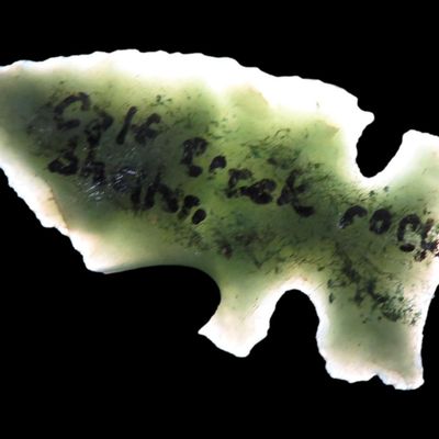 Sale Photo Thumbnail #7: Incredible Green Side Notch Birdpoint found at the Calf Creek Rock Shelter, Searcy County Arkansas, Beautiful Vibrant Translucent Green Material. Ex Joey Ellis Collection.