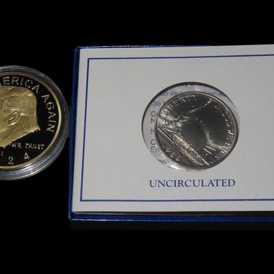 Sale Photo Thumbnail #976: President Trump Coin & 1986 Ellis Island Half Dollar, Trump Coin is a  Silver Dollar Sized Coin.