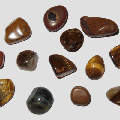 Sale Photo Thumbnail #633: Lot of Polished Tiger Eye Gemstones.