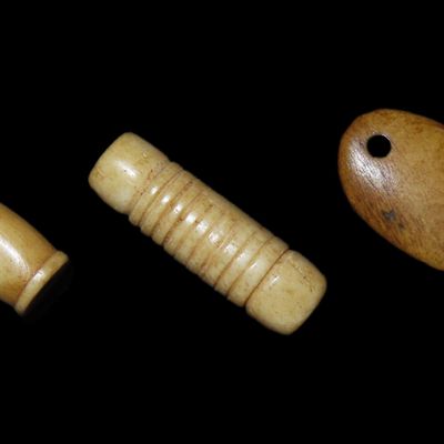 Sale Photo Thumbnail #635: Bone Pendant & Engraved Beads found in South Dakota. Highly Polished Examples, Mandan Culture, Circa 1600-1700's