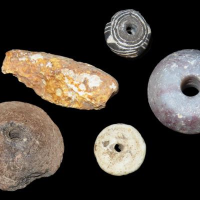Sale Photo Thumbnail #405: Nice lot of Drilled Pre-Columbian Beads, Stone, Clay, & Shell, some engraved. Found in Mexico. One is a olorful Purple stone, well polished.