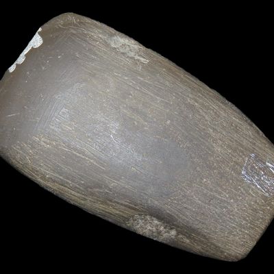 Sale Photo Thumbnail #107: Incredible 2 7/8" Hematite Celt found in St. Clair Co.,Illinois. Motley COA. Nicely Squared Sides and top, well polished example with no brianer patina.