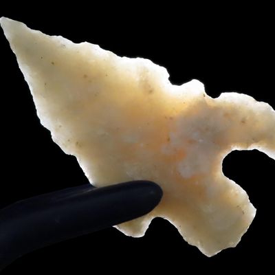 Sale Photo Thumbnail #4: Outstanding Texas Bird Point, Charcos Serrated Eccentric Arrowhead. Translucent. Found in Uvalde County, TX.
