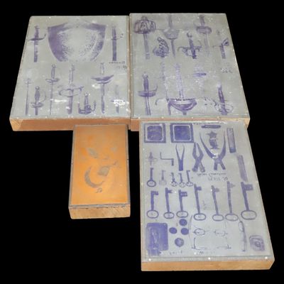 Sale Photo Thumbnail #702: Lot of 4 Antique Printing Plates with Swords, Shields, Bullet Molds, Skeleton Keys, Army, Navy, Tools, etc. Used in Rev. Heike's Book on guns. Includes a Copper Print Plate of a Wall mounted Buck.