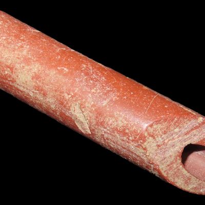 Sale Photo Thumbnail #190: 3 1/2" Catlinite Tube Pipe found in South Dakota. Well polished and heavily patinated. Salvaged from a larger pipe, one end smoothed over for continued use, evenly patinated.