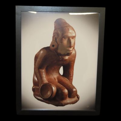 Sale Photo Thumbnail #783: Framed 8 1/2" x 11' Picture of the Cahokia Chunkey Player Pipe found near Ocumulgee, Oklahoma in 1900. Circle Roller, Discoidal in hand.