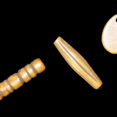 Sale Photo Thumbnail #820: Bone Pendant & Engraved Beads found in South Dakota. Highly Polished Examples, Mandan Culture, Circa 1600-1700's