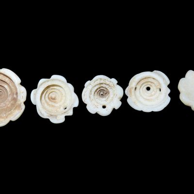 Sale Photo Thumbnail #933: Lot of Antique Engraved Shell Hair Adornment Beads found in West Africa.
