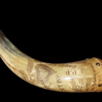 Sale Photo Thumbnail #198: Incredible Engraved Civil War Era Powder Flask / Horn. Cannon, Trumpet, Horse,Initials JPD, 10th RGT., 7th RGT, Infantry, Calvalry, Artillery, etc all Intricatly Carved Into it.