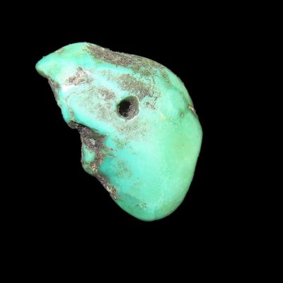 Sale Photo Thumbnail #246: Colorful Mimbres / Hohokam Turquoise Pendant found in Arizona. Nicely shaped and polished example, drilled for suspension.