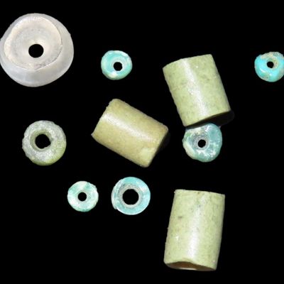 Sale Photo Thumbnail #437: Lot of 10 Pre-Columbian Mayan Green Jade Beads. Guatemala. Several Barrell / Tube Beads, Disc Beads, One Clear Quartz Doughnut Bead.