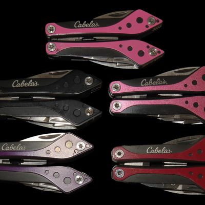 Sale Photo Thumbnail #972: Lot of 5 New Cabela's Brand Pocket Knife Multi Tools, Pliars, Knife, Flat & Phillips Screwdriver, Scissors, Can Opener, Saw. New & Unused.