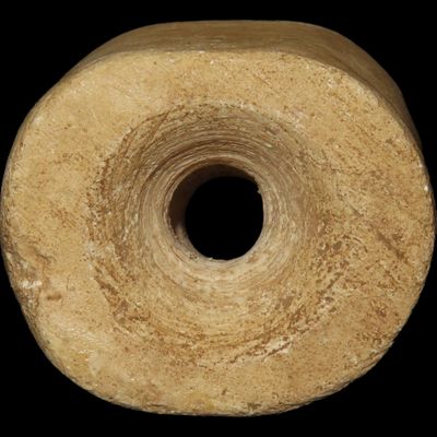 Sale Photo Thumbnail #417: Huge Pre-Columbian Bi-Conically Drilled Stone Barrel Bead, Mexico. About 1 1/2" x 1 1/2". Nicely polished and heavily patinated Limestone.