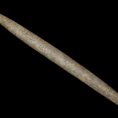Sale Photo Thumbnail #115: 3 5/16" Double Ended Bone Awl found in Stone Co., Arkansas. Partain COA. Well polished and nicely patinated example. Ex Adam Grey & Joey Ellis Collections.
