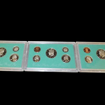 Sale Photo Thumbnail #865: Lot of 3 U.S. Proof Sets, 1996, 1997, 1998. 15 Total Coins all in original Sealed Housings by the United States Mint, With Original Boxes too.