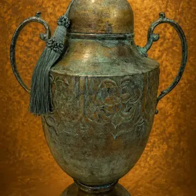 Ornate Patinated Metal Urn with Lid & Tassel