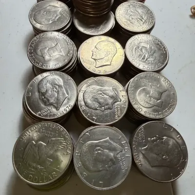 Sale Photo Thumbnail #2: 55 CIRCULATED CONDITIONS EISENHOWER CLAD DOLLARS MIXED YEARS AS PICTURED. $7 DOMESTIC SHIPPING.
