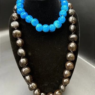 Chunky Beaded Necklaces Featuring A Hawaiian Kukui Nut Lei