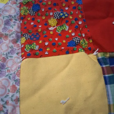 hand made lap quilt with writing on back side