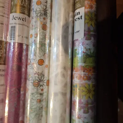 assorment of cello wrap rolls.