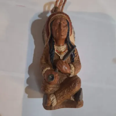 Ornament- Native American Style Seated Hunter Warrior Figurine with Feather Headdress & Rifle