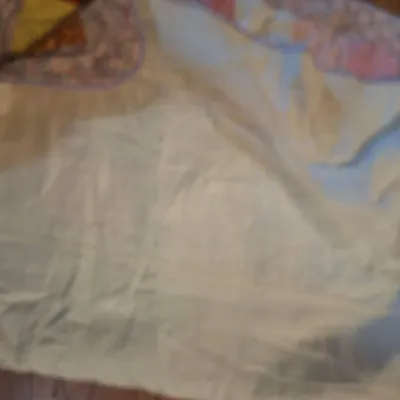 hand made lap quilt with writing on back side
