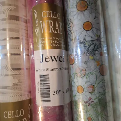 assorment of cello wrap rolls.