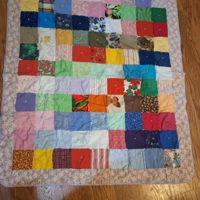 hand made lap quilt with writing on back side