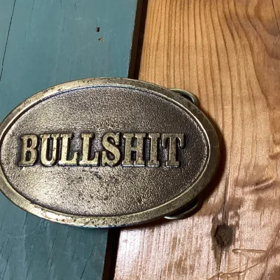 Vintage 1982 The Great American Buckle Co. 'Bullshit' Brass Belt Buckle