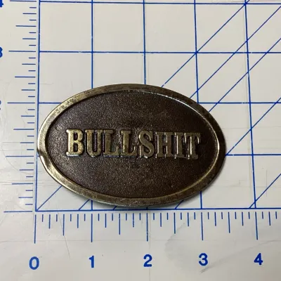 Vintage 1982 The Great American Buckle Co. 'Bullshit' Brass Belt Buckle