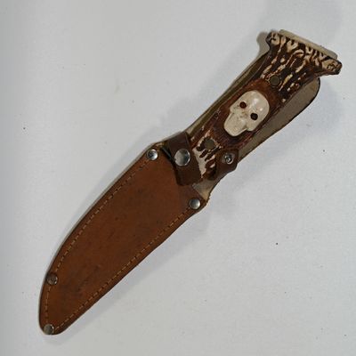 Buck Knife with Skull Engraved on Handle