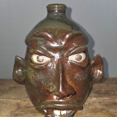 Sale Photo Thumbnail #280: Wayne Hewell Rock Tooth & Cigar Face Jug
