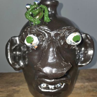 Sale Photo Thumbnail #271: Jerry Brown Folk Pottery Face Jug with Frog