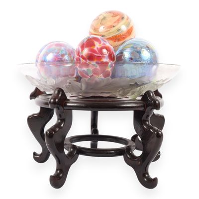 An Assortment of Eleven Blown Art Glass Spheres in a Frosted Glass Bowl on an Oriental Rosewood Stand